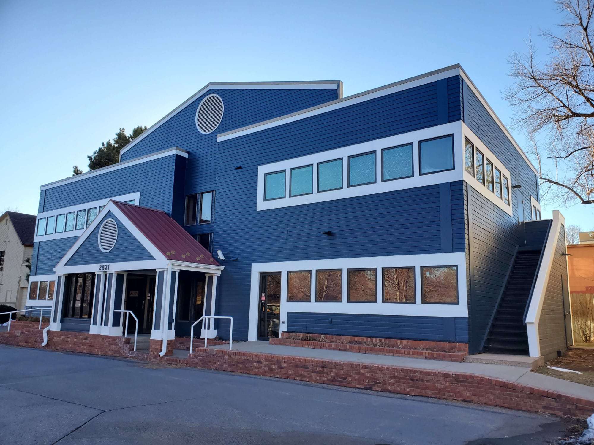 Blue commercial building painted by Pete’s Commercial Painting